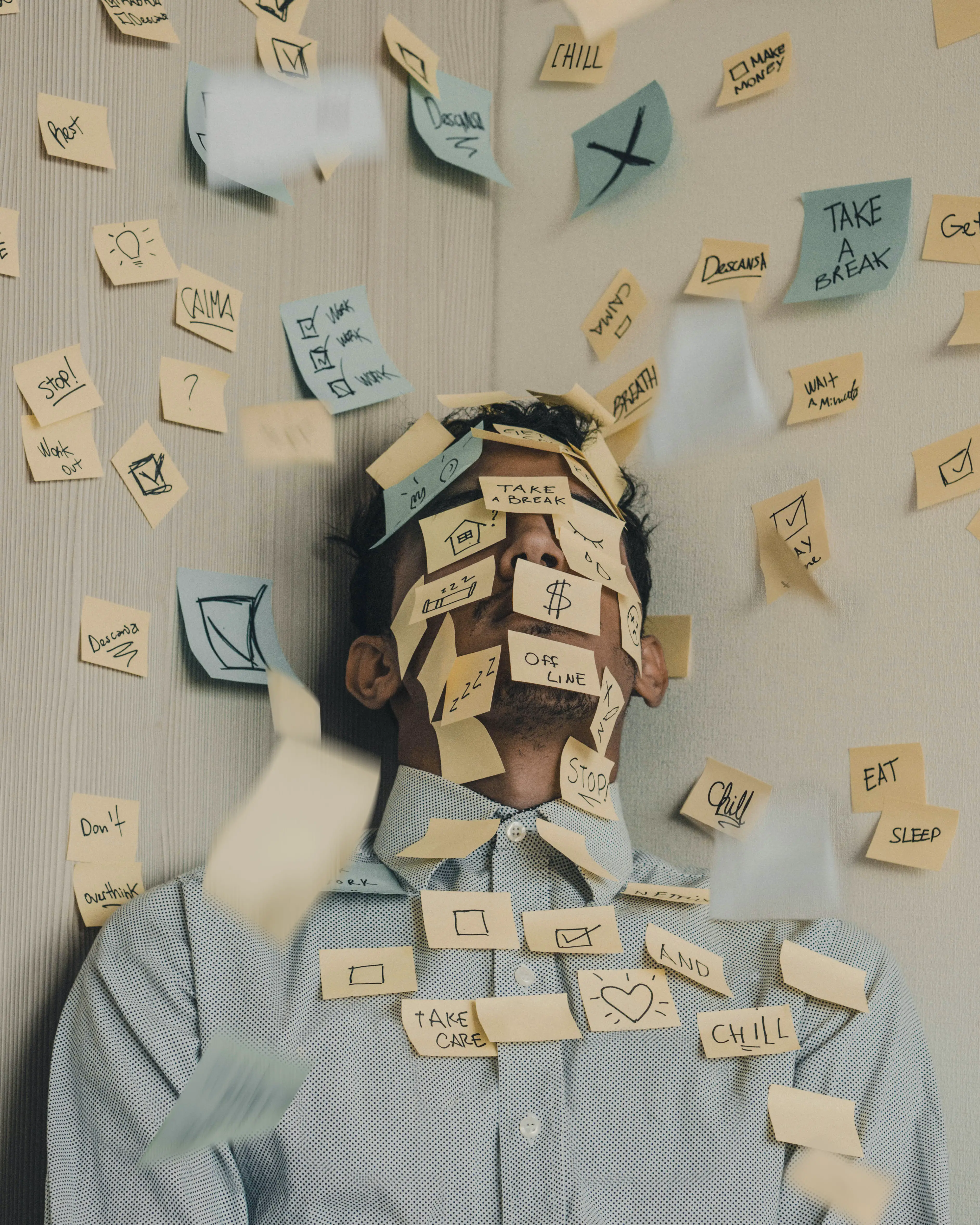 Man overwhelmed with post-its